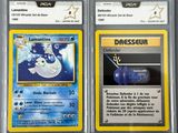 two pokemon cards with different designs on them in a plastic case