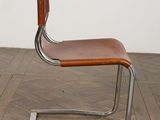 an image of a chair that is on a wooden floor