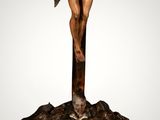 statue of jesus on the cross on a wooden base