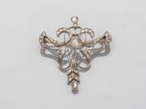 a diamond and gold broochle broochle