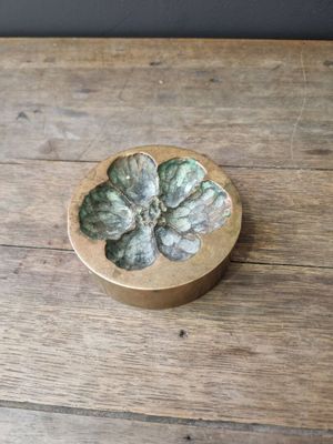 an image of a wooden box with a flower on it
