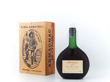 a bottle of wine sitting next to a wooden box