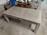 a table that is made of wood in a room