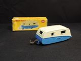 a blue and white toy truck with a trailer attached to it