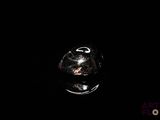 an image of a glass of wine in the dark