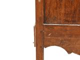 a small wooden chair with a wooden seat on it