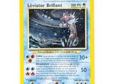 a close up of a pokemon card on a white surface