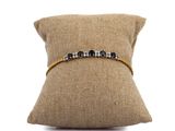 a close up of a cushion with a pillow on it