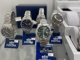 a lot of watches on display on a glass table