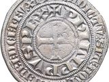a close up of a silver coin on a white background