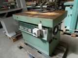 a machine that is sitting on a pallet in a warehouse