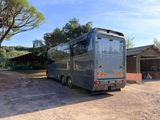 an image of a bus parked in front of a house