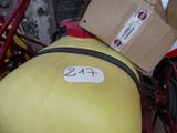 a yellow motorcycle with a box on the back of it