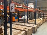 many boxes on the shelves in the warehouse