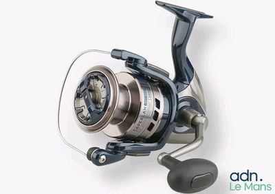 a close up of a spinning reel on a white surface