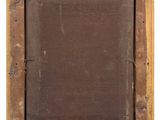 an old wooden picture frame with a label on it