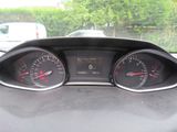 a picture of a dashboard of a car with gauges
