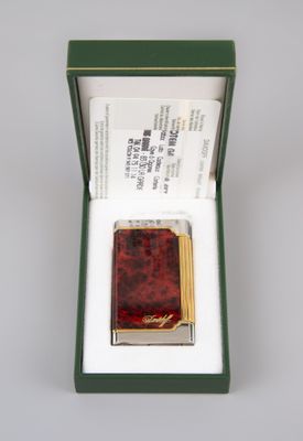 a small box with a small red book inside of it