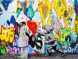 painting of a boy with a balloon and a dog in front of a wall covered in graffiti