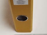 the yellow box is holding a ruler and a piece of paper