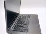 a laptop computer that is sitting on a white surface