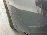 a close up of a car ' s paint job on the side of the car