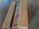 two pieces of wood sitting on the floor next to each other