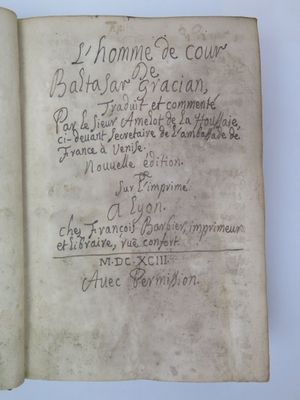 an old book with writing on it sitting on top of a table