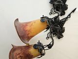 two vases that are hanging on the wall