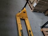 a forklift that is sitting on the floor in a warehouse