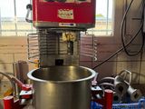 a mixer that is sitting on a counter in a kitchen