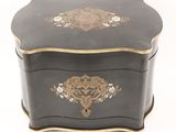 a black box with a gold decoration on it
