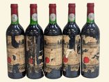 four bottles of wine are lined up in a row