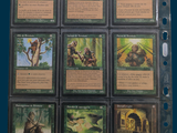 a lot of cards that are in a binder