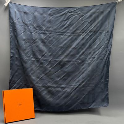 an orange box is sitting next to a black and white photo