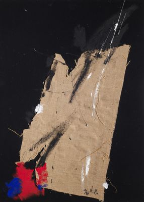 an image of a piece of brown paper with red and blue paint on it