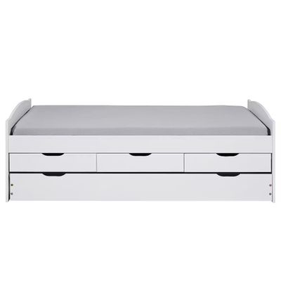 a white bed with two drawers underneath it and a mattress