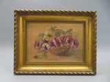 un tableau représentant des fleurs dans un panier posé sur une table près d'un mur
