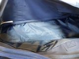 a blue bag with a zipper on the inside of it