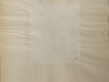 a piece of paper taped to the wall with a piece of tape on it