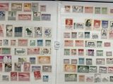 many different stamps on the pages of a book