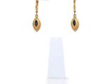 an image of a pair of earrings on a display stand