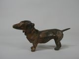 bronze statue of a dog on a white background