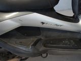 a motor scooter that is parked in a garage