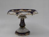 an image of a blue and white vase on a stand