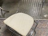 a chair that is sitting on a rug in a room