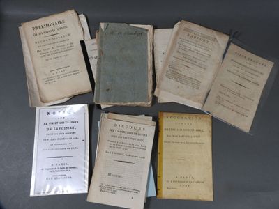 several old books sitting on top of a table next to each other