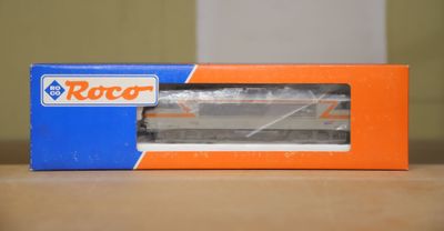 an orange and blue box sitting on top of a wooden table