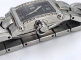 a close up of a wrist watch on a white surface