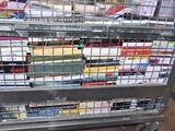 a metal cart with many books on top of it